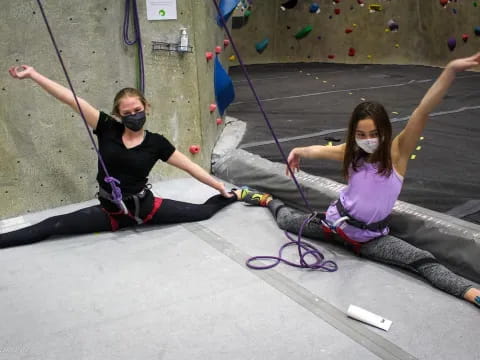 a couple of girls on a swing