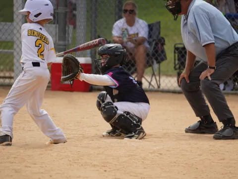 a kid swinging a baseball bat