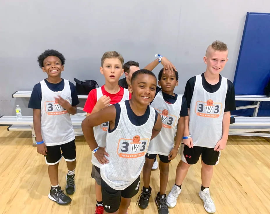 a group of boys wearing numbers