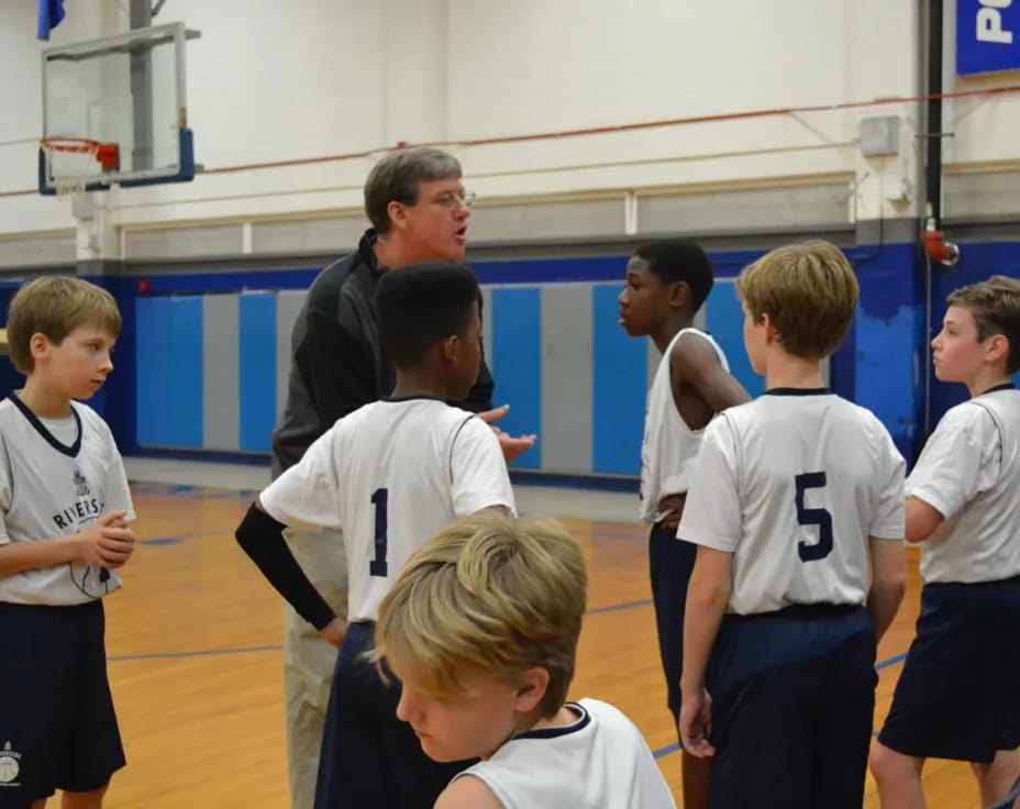 a group of boys in a gym