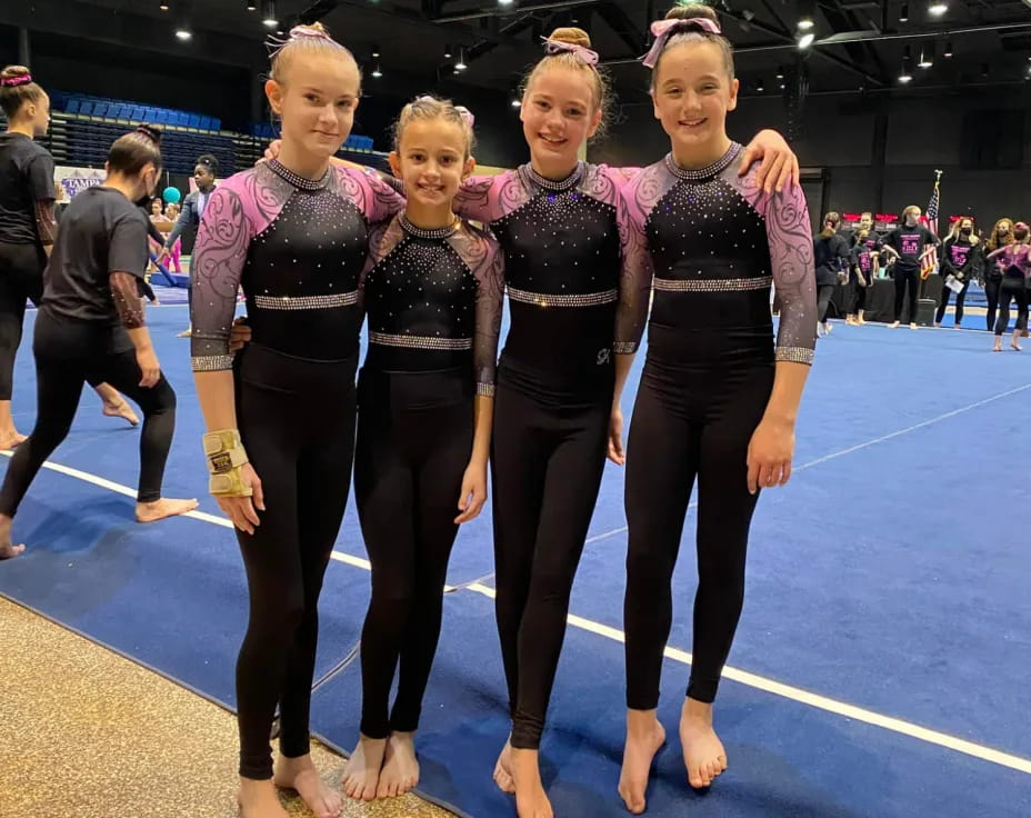 a group of women posing for a photo