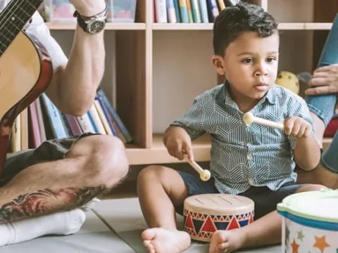 a baby sitting on the floor