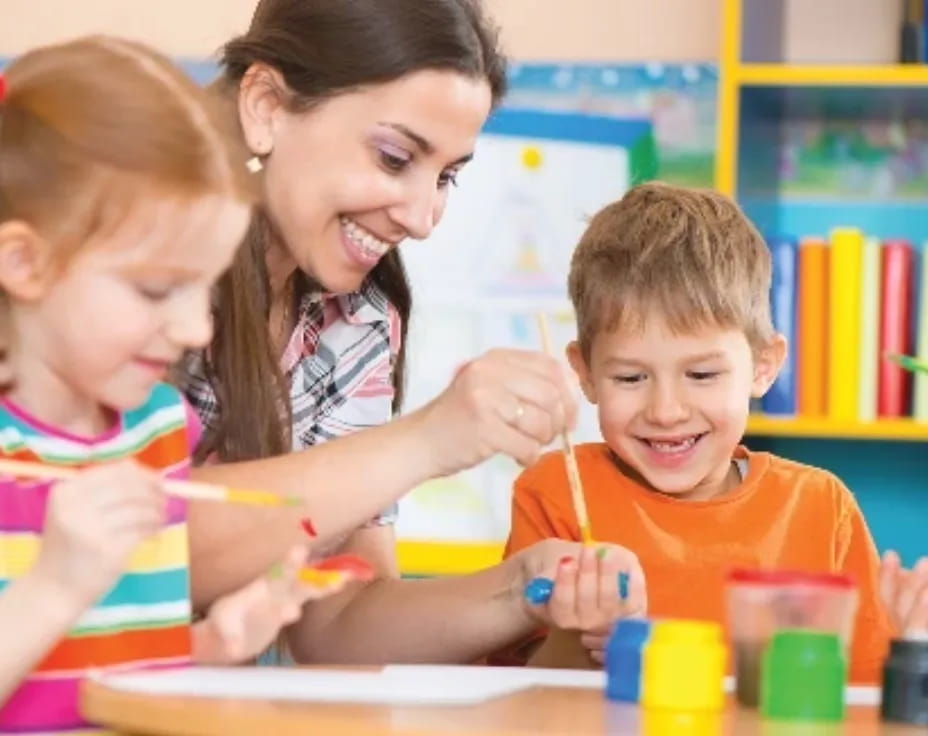 a person and children painting