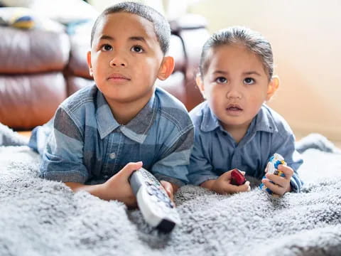 two boys playing with toys