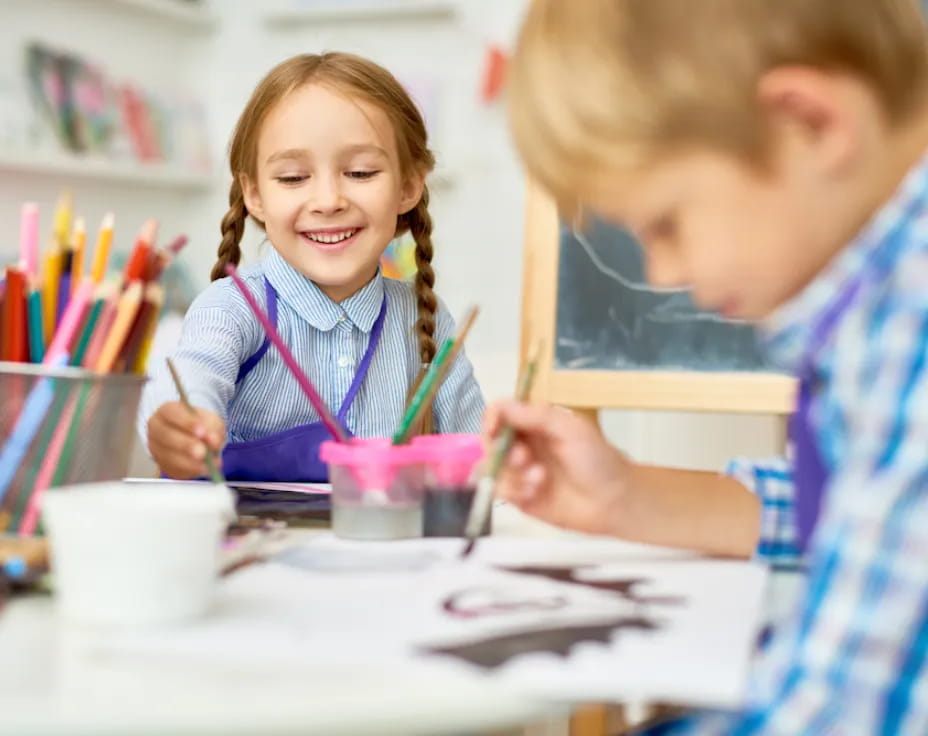 a boy and girl painting