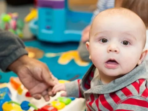a baby being held by a person