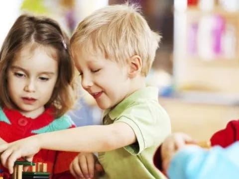 a few children playing with toys