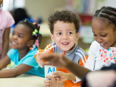 a group of children smiling