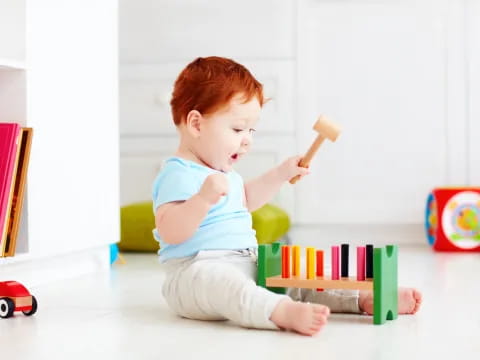 a baby playing with toys