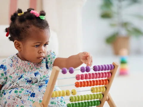 a baby playing with a cake