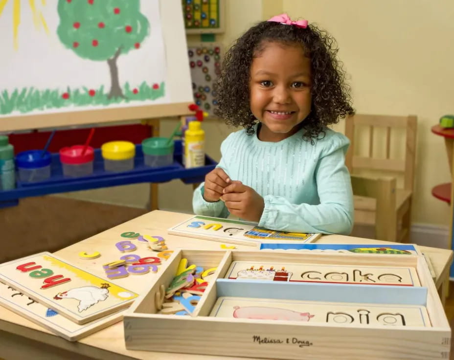 a girl sitting at a table