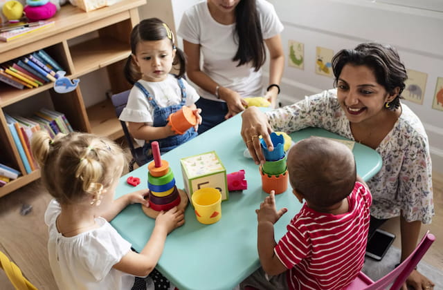a person and children playing with toys