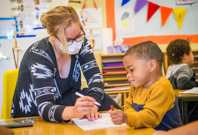 a teacher helping a student