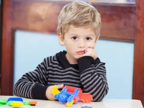 a child sitting at a table