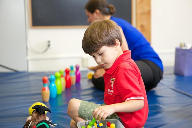 a boy playing with toys