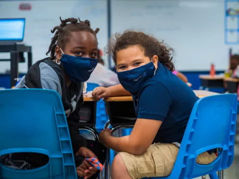 a few children wearing face masks