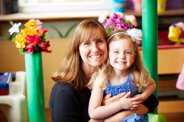 a person holding a child