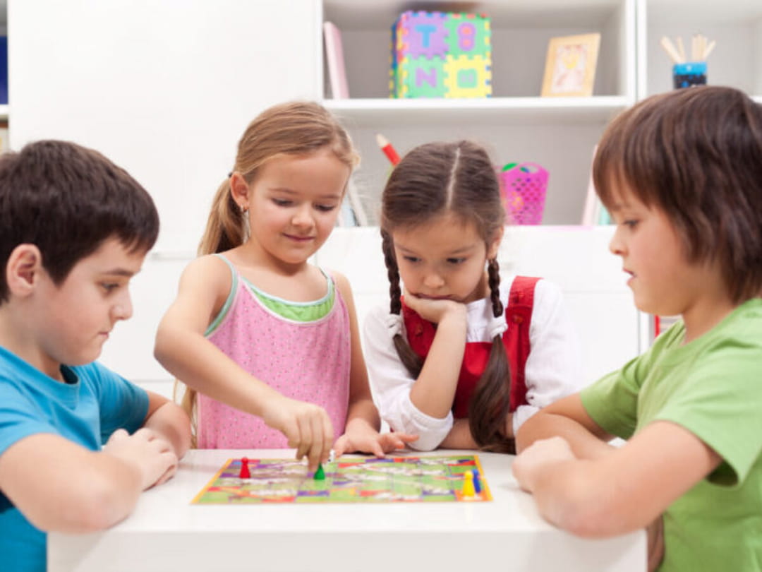 a group of children playing with a puzzle