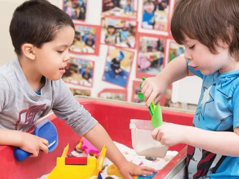 a couple of kids playing with toys
