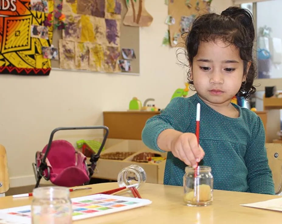 a child sitting at a table