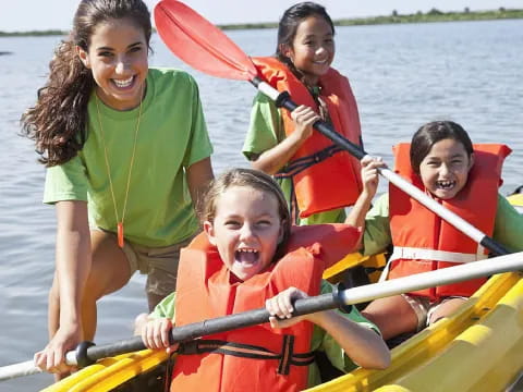 a group of people in a canoe