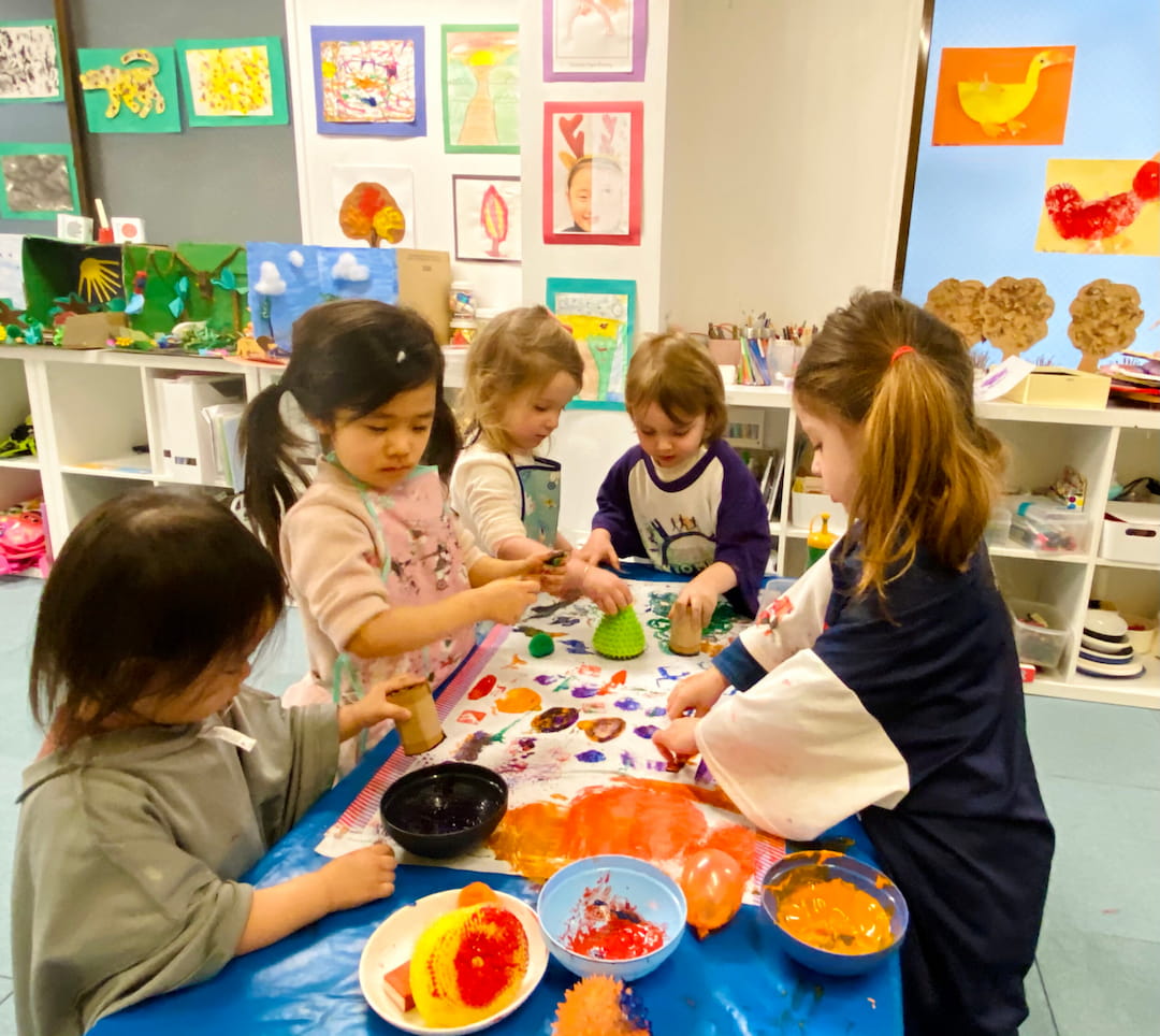 a group of children painting