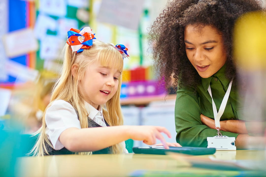 a person and a girl looking at a book