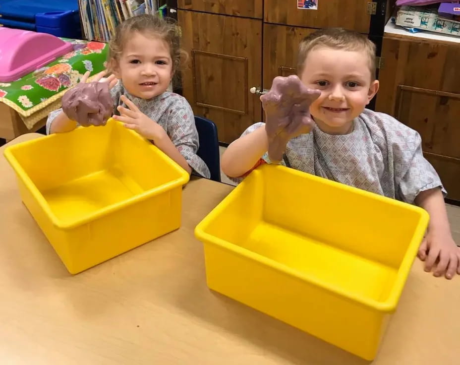 a couple of kids playing with toys