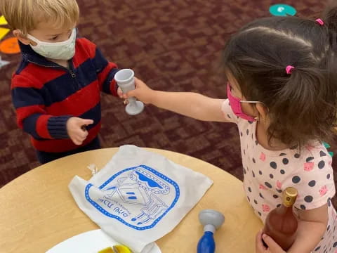 a couple of kids playing with toys