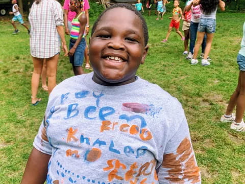 a boy holding a sign