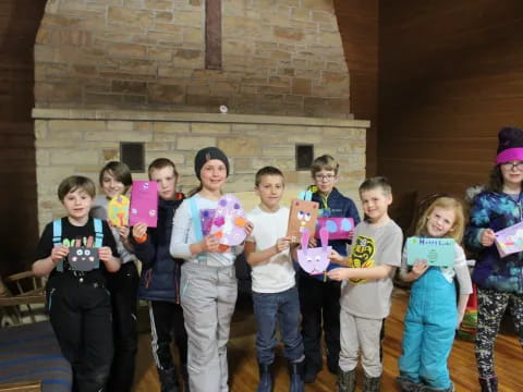 a group of children holding books