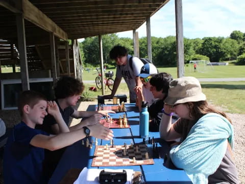 a group of people playing chess