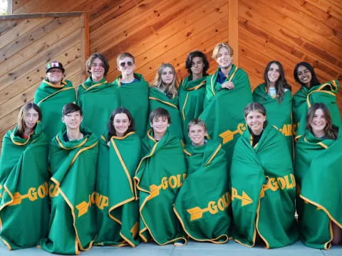 a group of people in green robes