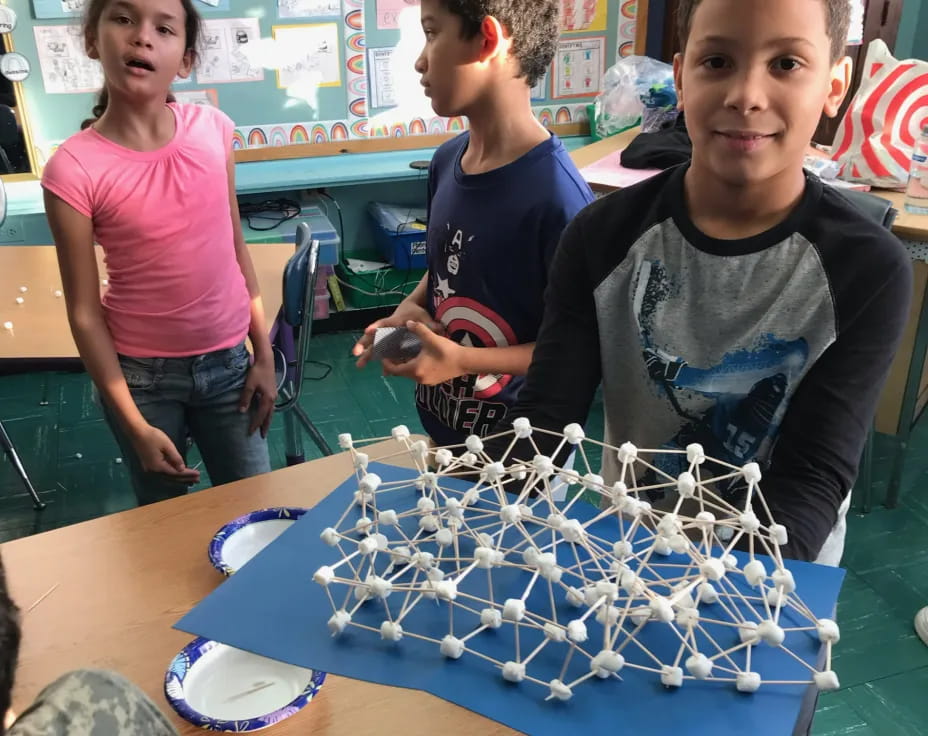 a group of kids playing a board game
