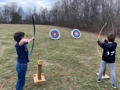 a couple of kids shooting targets