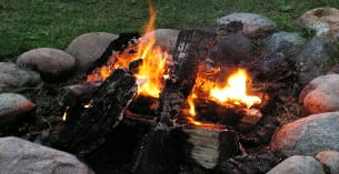 a fire burning in a pit