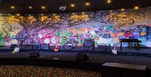 a stage with a large mural
