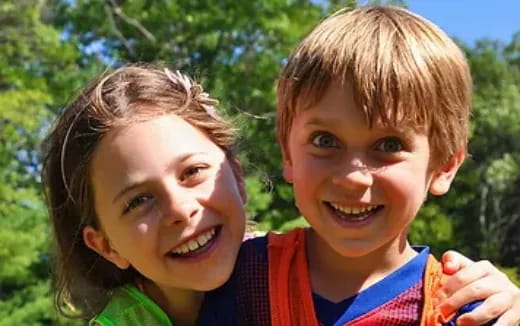 a boy and girl smiling