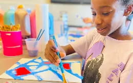 a young girl painting