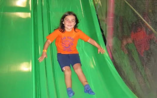 a girl in a yellow shirt