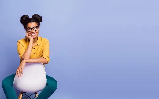 a woman sitting on a blue chair