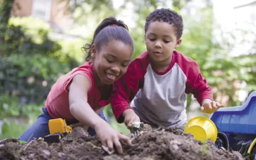 medium shot of kids digging