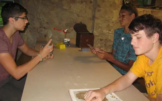 a group of people sitting around a table