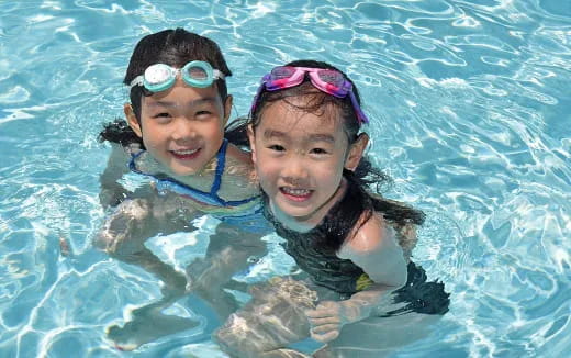a group of girls in a pool