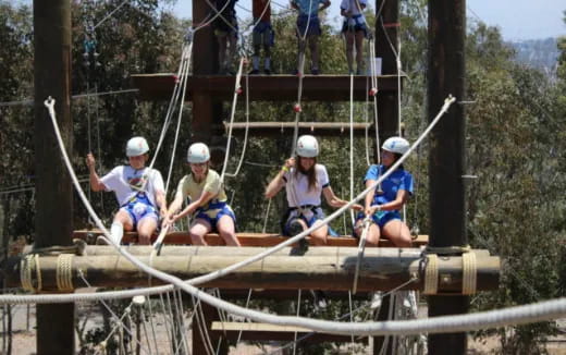 a group of people on a wooden structure