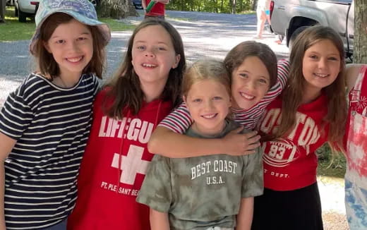a group of girls posing for a photo