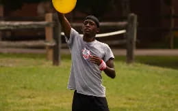 a man throwing a frisbee