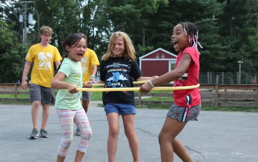 a group of people holding sticks