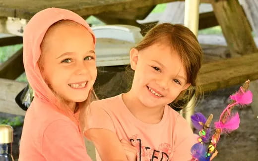 a couple of girls smiling