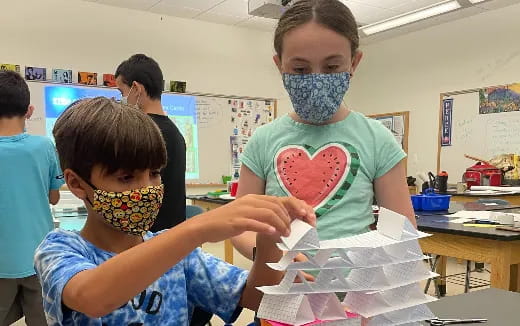 a young boy with a face mask